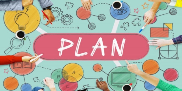 A group of people sitting around a table with a plan AI-generated content may be incorrect.